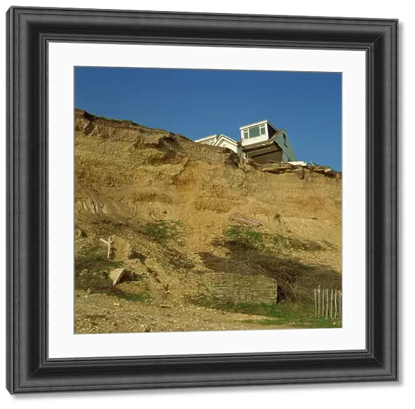 House about to topple over cliffs, Barton-on-Sea, Hampshire, England, United Kingdom