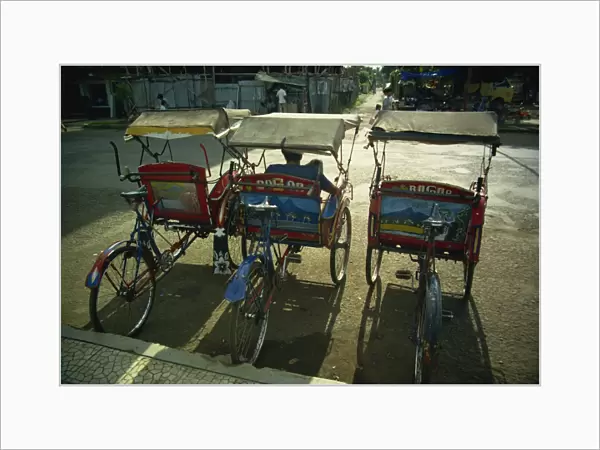 Parked becaks (trishaws), Bogor, West Java, Indonesia, Southeast Asia, Asia