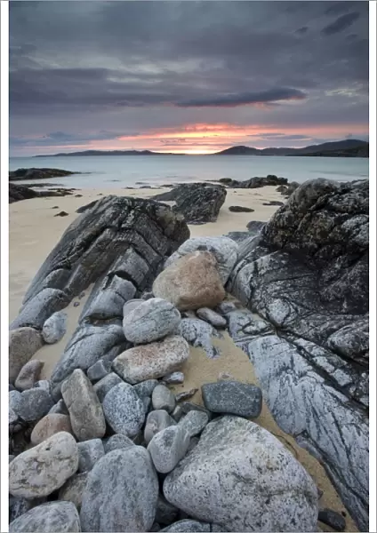 View towards Taransay at sunset from the rocky shore at Scarista, Isle of Harris