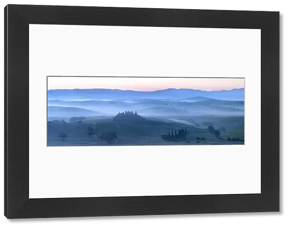 Misty dawn panoramic view towards Belvedere, across Val d Orcia, UNESCO World Heritage Site