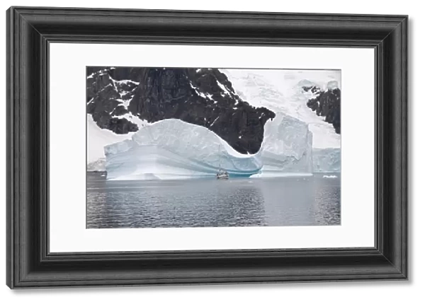 Sailing yacht and iceberg, Errera Channel, Antarctic Peninsula, Antarctica, Polar Regions