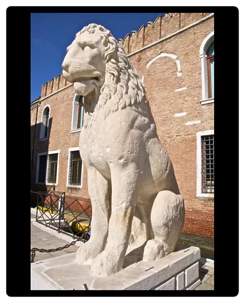 Greek antique lion statue outside the land entrance to the Arsenal, Venice