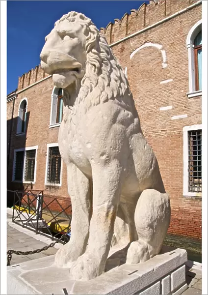 Greek antique lion statue outside the land entrance to the Arsenal, Venice