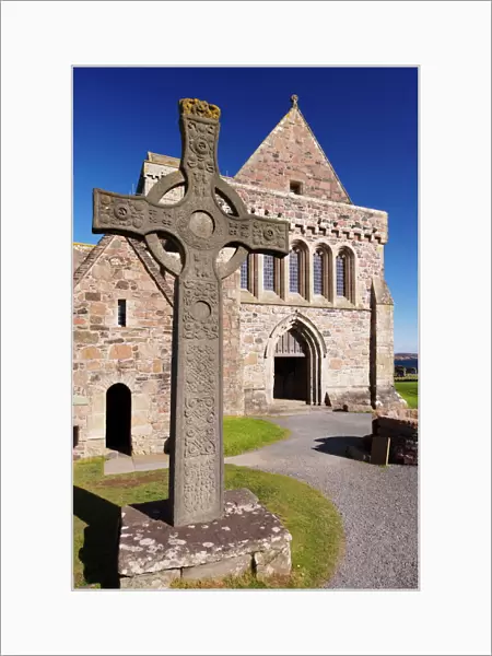 Replica of St. Johns cross stands proudly in front of Iona Abbey, Isle of Iona