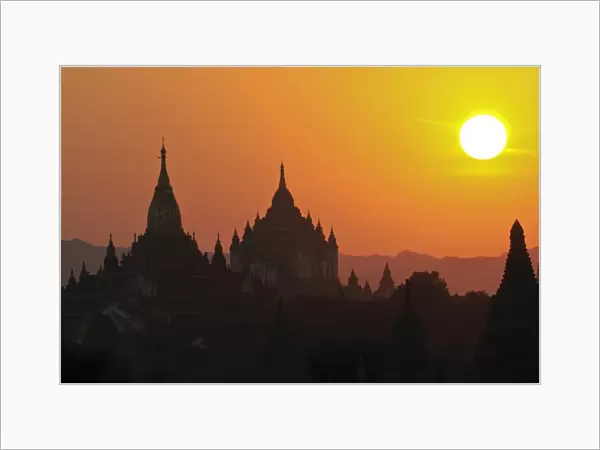 Silhouettes of the temples and pagodas of the ruined town of Bagan at sunset
