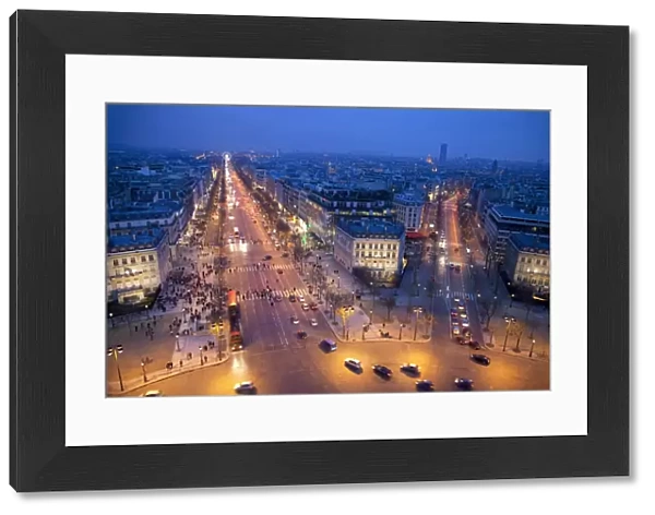 The Champs Elysees at night from the Arc de Triomphe, Paris, France, Europe
