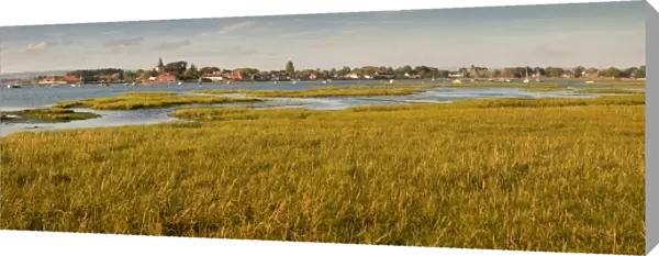 Distant view of church at Bosham, Chichester Harbour at high tide, West Sussex, England, United Kingdom, Europe