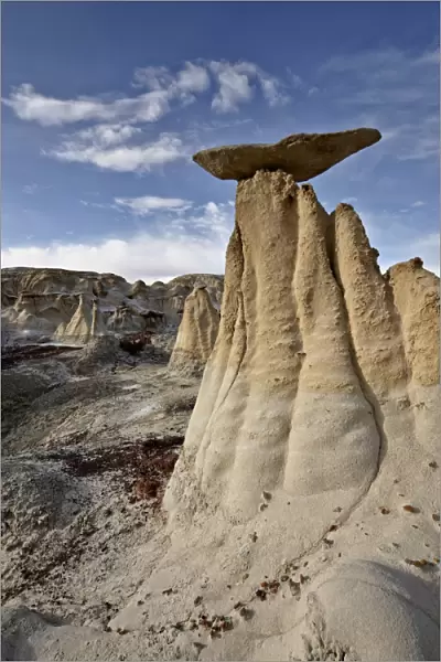 Yellow hoodoos under clouds, San Juan Basin, New Mexico, United States of America, North America