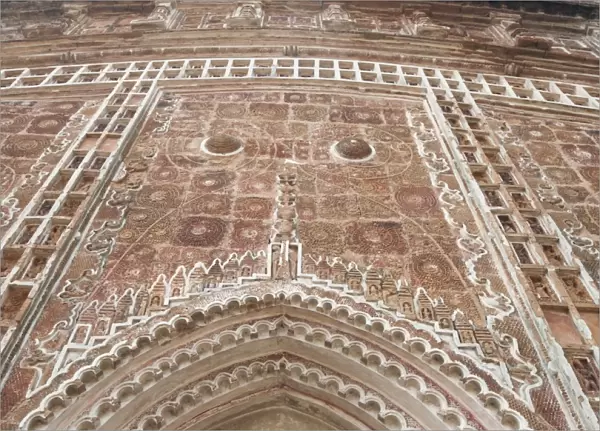 Carved terracotta work above arched doorway in the Lalji Mandir, one of the terracotta temples at Kalna, West Bengal, India, Asia