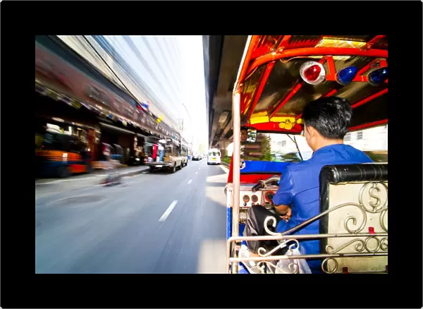 Tuk tuk driver speeding in Bangkok, Thailand, Southeast Asia, Asia