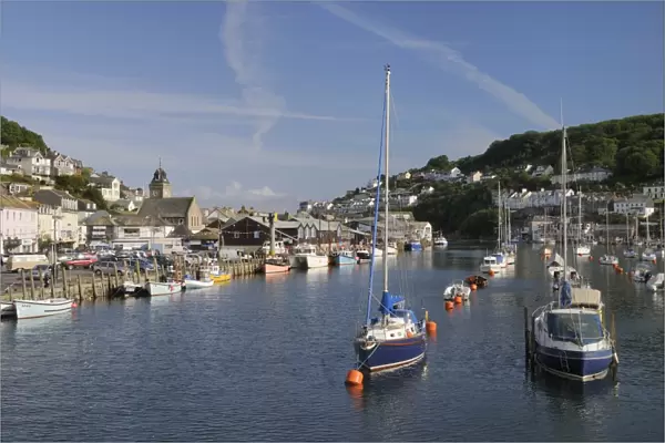 Sailing yachts and fishing boats moored in Looe harbour, Cornwall, England, United Kingdom, Europe