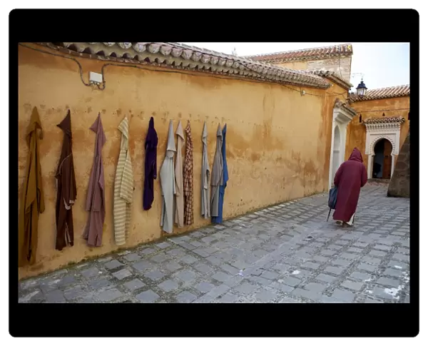 Djellaba garments hanging on a wall, Chefchaouen, Morocco, North Africa, Africa