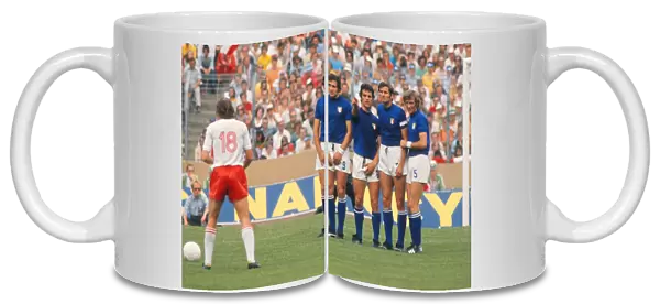 Italy players Tarcisio Burgnich, Fabio Capello, Giacinto Faccheti face a Polish free-kick at the 1974 World Cup