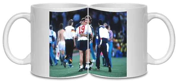 Paul Gascoigne is consoled by Tony Dorigo after England are knocked out of the 1990 World Cup