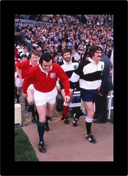 Phil Bennett leads out the British Lions while his Welsh teammate Gerald Davies captains the Barbarians in the 1977 Silver Jubilee Match