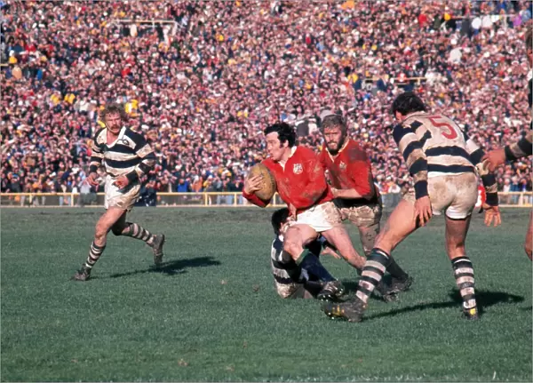 Phil Bennett makes a break for the Lions on the way to scoring a try against Auckland in 1977