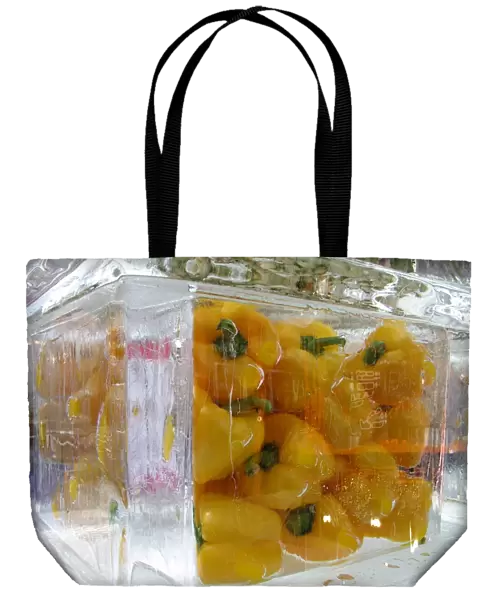 Yellow peppers set in ice