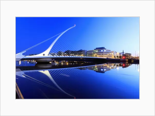 Europe, Dublin, Ireland, Samuel Beckett bridge by night reflecting on the Liffey river