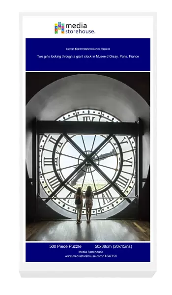 Two girls looking through a giant clock in Musee d Orsay, Paris, France