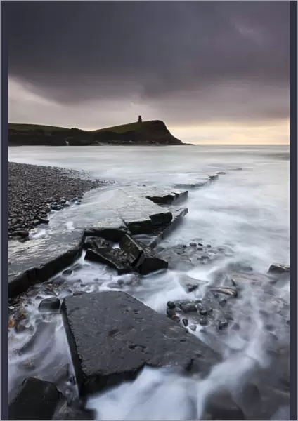 High tide flows around the broken ledges on the shores of Kimmeridge Bay on the Jurassic Coast