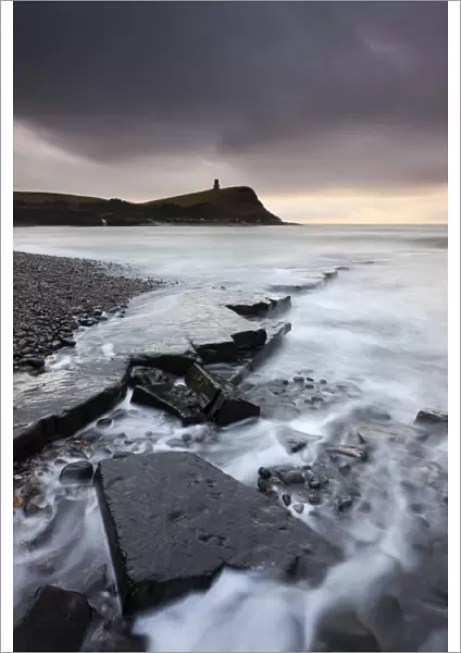 High tide flows around the broken ledges on the shores of Kimmeridge Bay on the Jurassic Coast