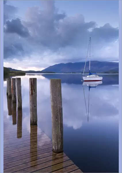 Yacht moored near Lodore boat launch on Derwent Water, Lake District, Cumbria, England