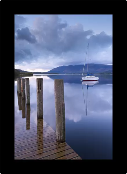 Yacht moored near Lodore boat launch on Derwent Water, Lake District, Cumbria, England