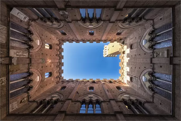 Siena, Tuscany, Italy, Europe. Classic bottom view of Palazzo Pubblico with Del Mangia s