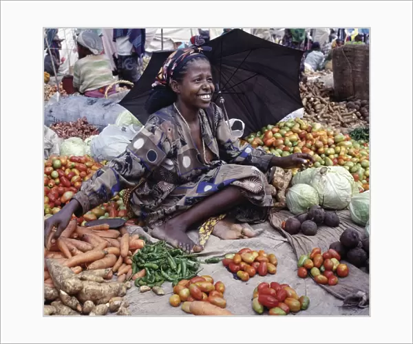 A woman sells vegetables at Bati market