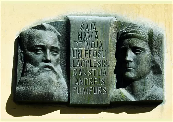 Wall Plaque with Face Carvings