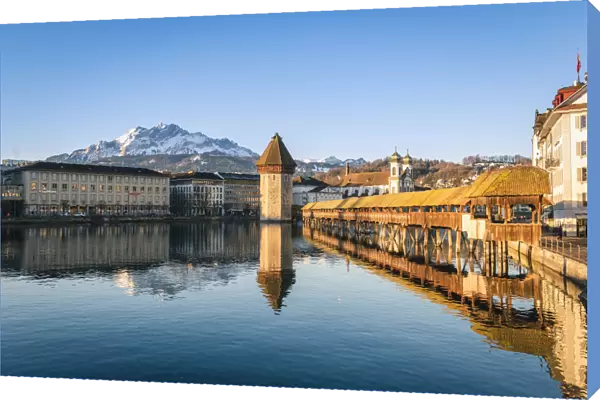 Lucerne, Switzerland. Kapellbrocke (Chapel Bridge) on Reuss river and mount Pilatus