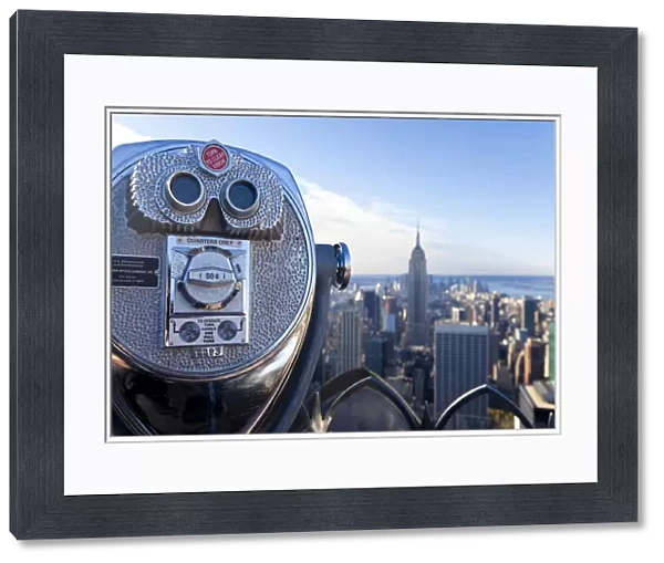 USA, New York City, Manhattan, Coin operated Binoculars and the Empire State Building viewed from the top of the