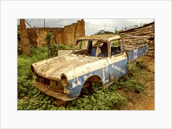 Africa, Benin, Ketou. A broken car at the outskirts of Ketou