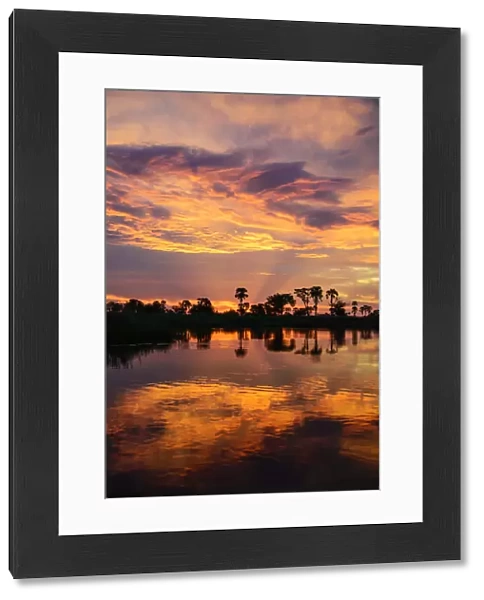 Africa, Botswana, Okavango delta. Sunset at the delta