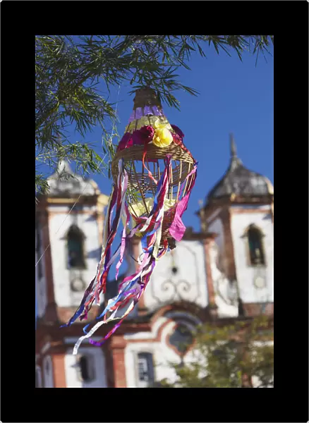 Decoration for festival with Our Lady of Conceicao de Antonio Dias Church in background