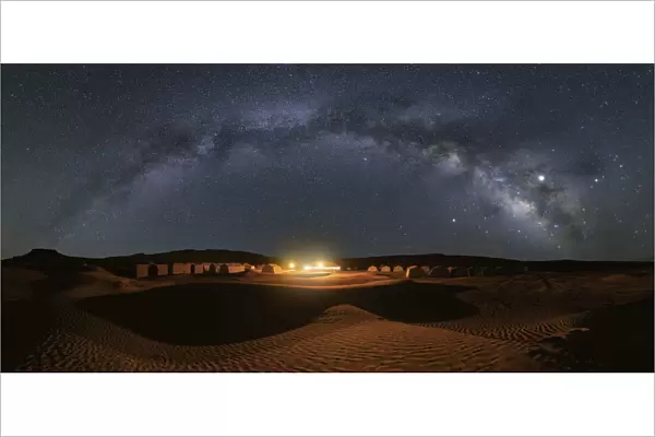 Milky way over Camp Mars village in the sand dunes, Sahara desert, Tunisia, Northern
