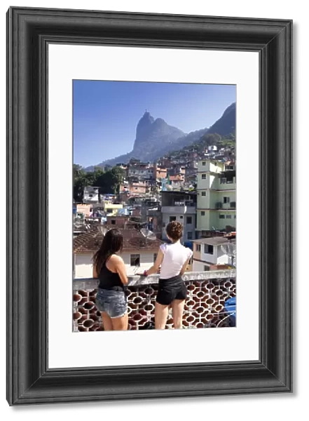 South America, Rio de Janeiro, Rio de Janeiro city, two girls look out over a view