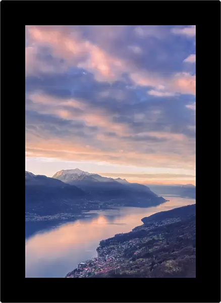 Stunning sunrise over Como Lake. San Bernardo Church, Monte Bregagno, Dongo, Como Lake