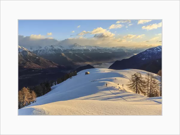 Ski mountaineer on Monte Olano at sunrise, Gerola Valley, Sondrio province, Valtellina