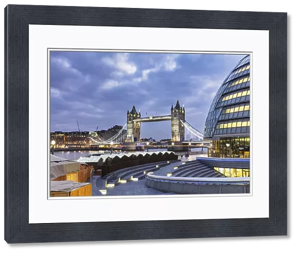 Tower Bridge and City Hall, right, designed by Norman Foster illuminated at Christmas