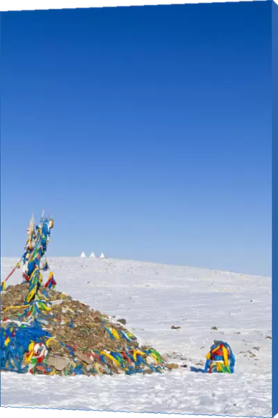 Mongolia, Ovorkhangai. An Ovoo, which is a type of sacred Buddhist cairn, by the roadside