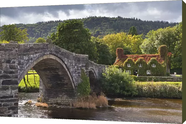 Ty Hwnt i r Bont ivy covered cottage and tea rooms beside stone bridge crossing