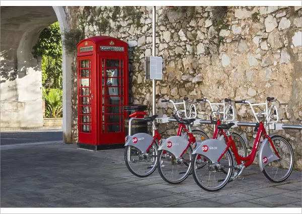 Gibraltar, Gibraltar, British red telephone box and hire bikes by Southport Gates