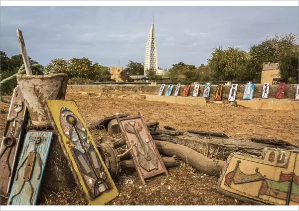 Africa, Senegal, Dakar. Art for sale on the island Goree, in the background the memorial