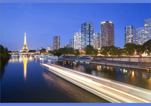 France, Paris, Night View Of River Seine With High-rise Buildings On The Left Bank