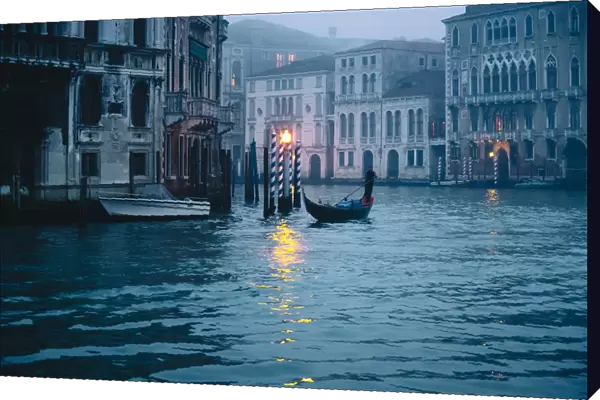 Gondolas near Rialto bridge during a cloudy day. Venice, Veneto, Italy