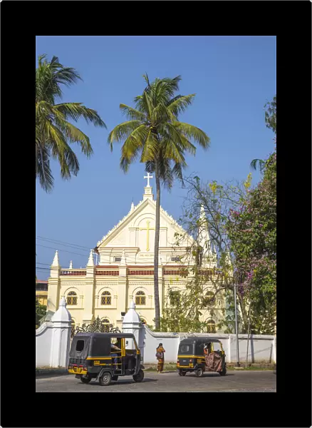 India, Kerala, Cochin - Kochi, Fort Kochi, Auto rickshaws passing infront of the Santa