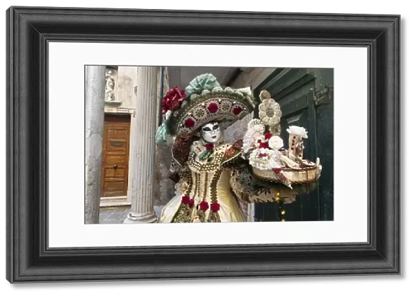 A woman in a beautiful costume poses during the Venice Carnival, Venice; Veneto; Italy
