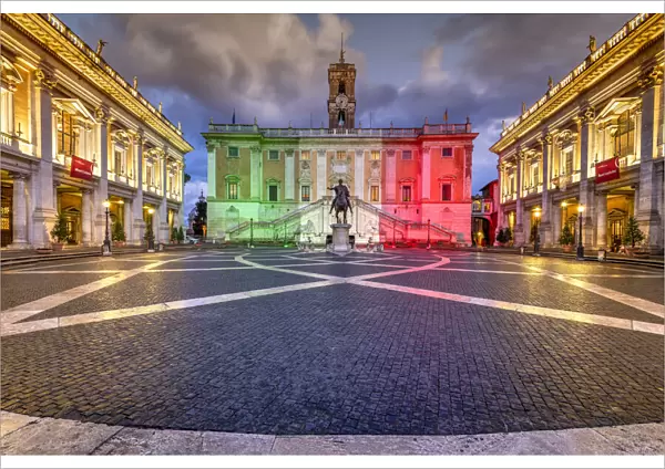 Piazza del Campidoglio with Palazzo Senatorio illuminated with the colors of the Italian