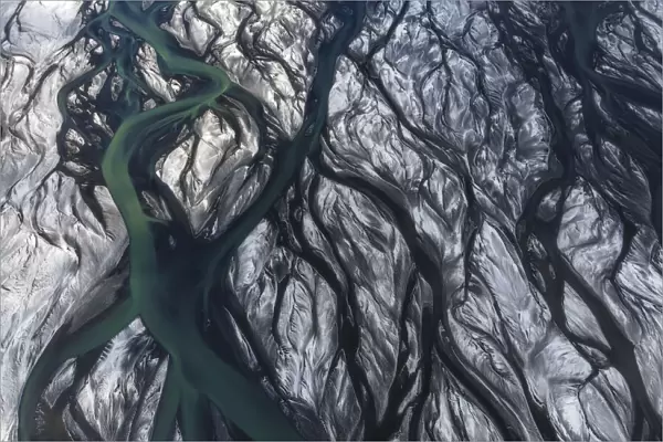 Aerial view of a river delta after a winter snowstorm in the southern part of Iceland. Thorsa river, Iceland